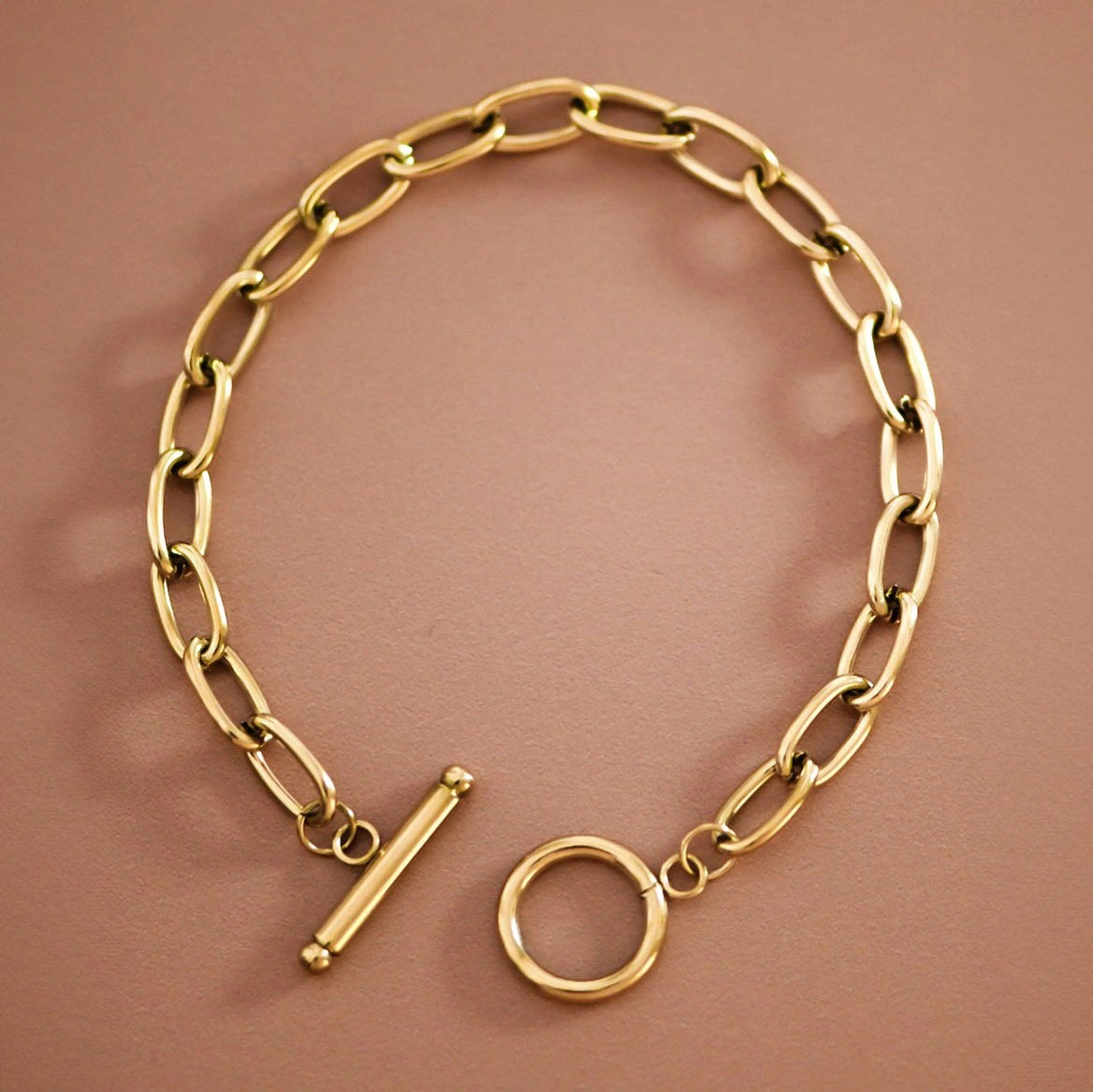 Chunky gold oval-link bracelet with toggle clasp
