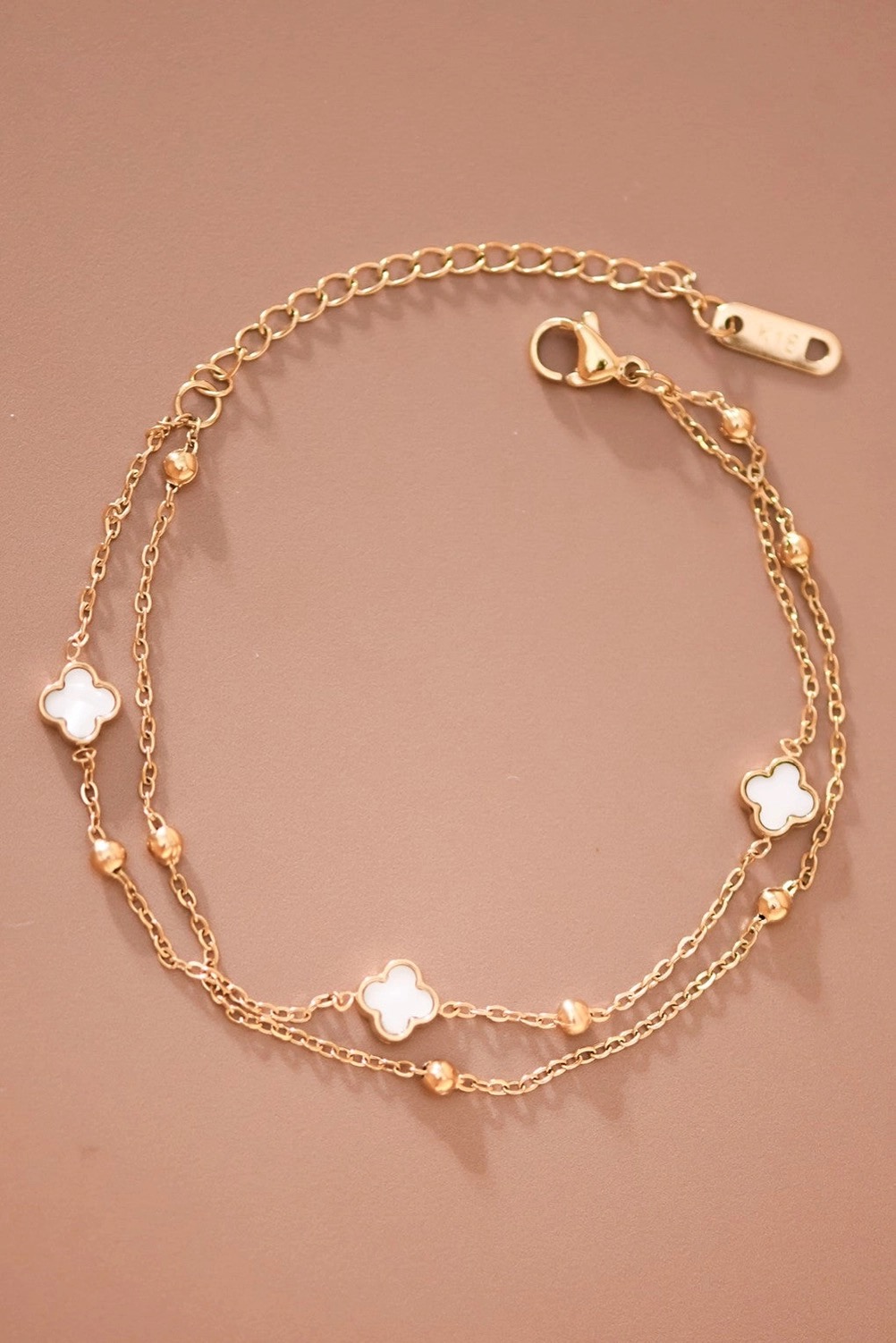 Double-layer gold bracelet with mother-of-pearl clovers