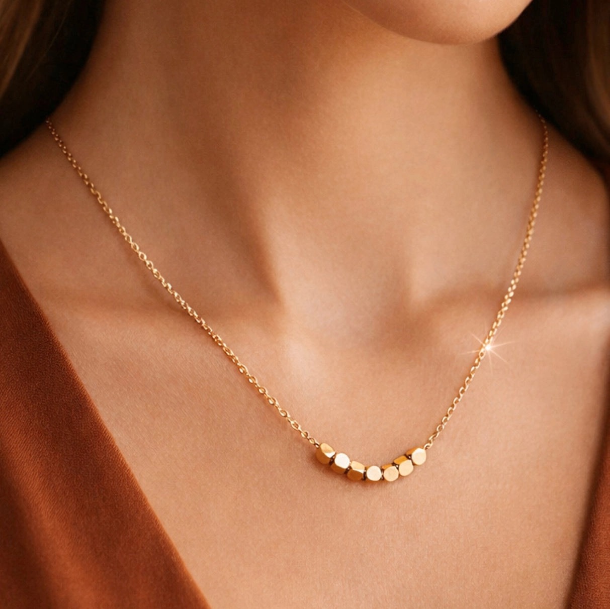 Fine gold chain necklace with polished bead detail